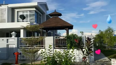 a house with a gazebo in front of it at VVIP Homestay Villa Proton City in Tanjung Malim