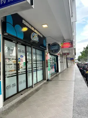 a store front of a grocery store with bikes parked at Muslim Homestay Apartment in George Town