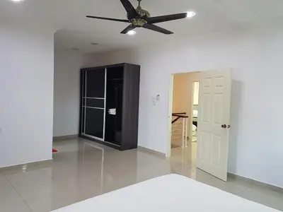 a living room with a ceiling fan and a door at Sitiawan Homestay Entire Semi D house in Sitiawan