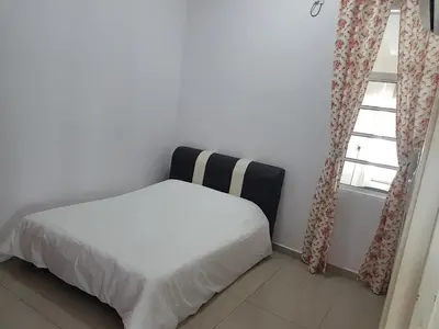 a bedroom with a white bed and a window at Sitiawan Homestay Entire Semi D house in Sitiawan