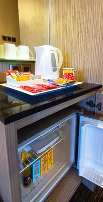 a refrigerator with its door open on a counter at Sunway Hotel Seberang Jaya in Perai