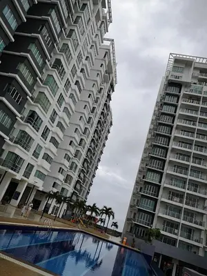 two tall buildings with a pool in front of them at \u672c\u5e97\u597d\u6c11\u5bbf in Sekincan