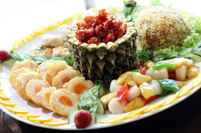 a plate of food with pineapple and other foods at Copthorne Hotel Cameron Highlands in Cameron Highlands