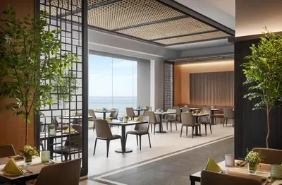 an image of a restaurant with tables and chairs at G Hotel Gurney in George Town