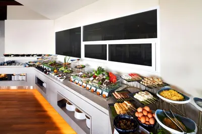 a buffet of food on a counter in a kitchen at DoubleTree by Hilton Damai Laut in Lumut