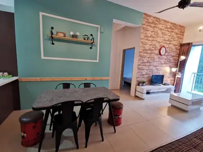 a dining room with a table and chairs at The Woodz Homestay - 3 Bedroom in Cameron Highlands