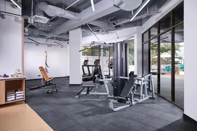 a gym with cardio equipment and treadmills at M Social Resort Penang in George Town