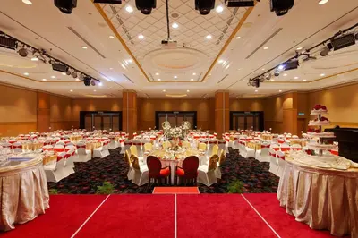a large banquet hall with white tables and chairs at Bayview Hotel Georgetown Penang in George Town
