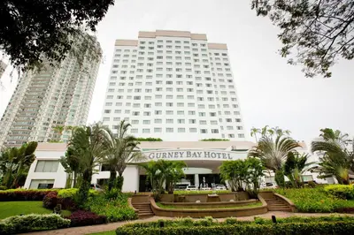 a large white building with two tall buildings at Gurney Bay Hotel, A PARKROYAL Partner Hotel in George Town