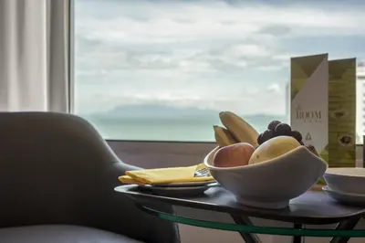 a bowl of fruit on a table in front of a window at Cititel Penang in George Town