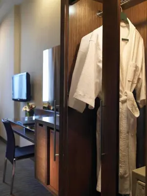 a robe hanging on a door in a hotel room at Cititel Penang in George Town