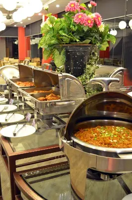 a buffet line with many different types of food at Hotel Sentral Seaview @ ​Beachfront in George Town
