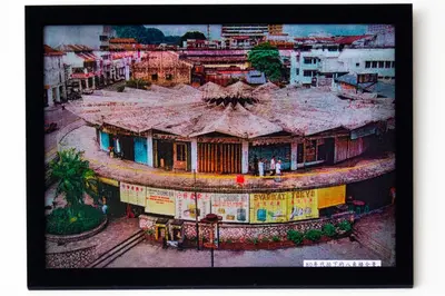 a painting of a building in a city at Octagon Premium Ipoh Town Center by Grab A Stay in Ipoh