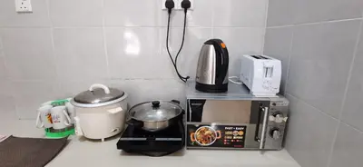 a kitchen counter with a coffee maker and a blender at My 2Rooms Apartments @ Golden Hills Pasar Malam in Cameron Highlands