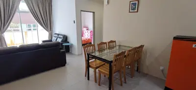 a living room with a glass table and chairs at My 2Rooms Apartments @ Golden Hills Pasar Malam in Cameron Highlands