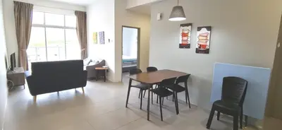 a living room with a dining room table and chairs at My 2Rooms Apartments @ Golden Hills Pasar Malam in Cameron Highlands