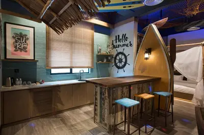 a kitchen with a counter and a clock on the wall at Vangohh Eminent Hotel & Spa in Bukit Mertajam
