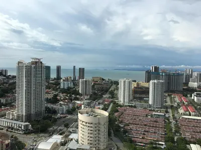 a view of a city with buildings and the ocean at The Landmark in George Town
