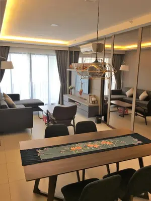 a living room with a table and chairs at The Landmark in George Town
