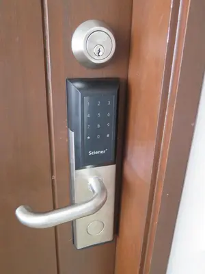 a soap dispenser is attached to a door at The Landmark in George Town