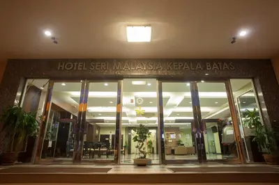 a hotel sign on the front of a building at Hotel Seri Malaysia Kepala Batas in Kepala Batas