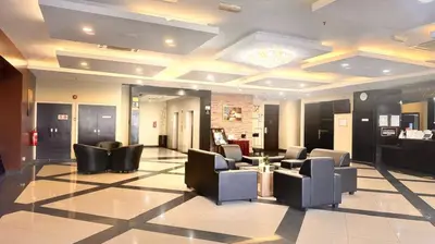 a lobby with couches and chairs in a salon at Hotel Seri Malaysia Kepala Batas in Kepala Batas