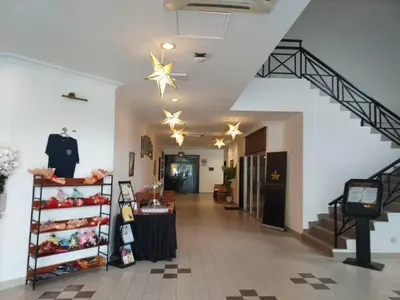 a store hallway with a staircase and a star ceiling at Hotel Seri Malaysia Pulau Pinang in Bayan Lepas
