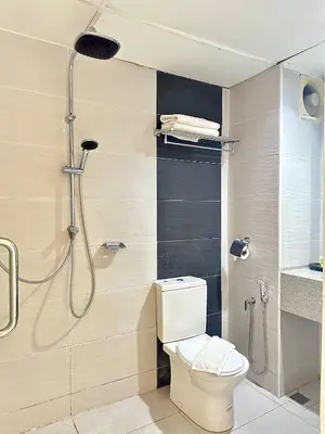a bathroom with a shower and a toilet in it at Hotel Seri Malaysia Pulau Pinang in Bayan Lepas