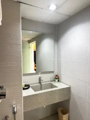 a bathroom with a sink and a mirror at Hotel Seri Malaysia Pulau Pinang in Bayan Lepas