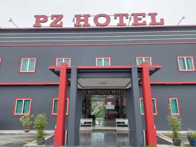 a large blue building with a sign on it at Pz Hotel in Kuala Kangsar