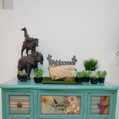 a blue cabinet with plants on top of it at De Nest Holiday home in Bayan Lepas
