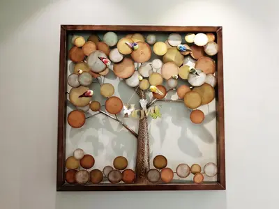 a picture of a tree made out of stones at De Nest Holiday home in Bayan Lepas