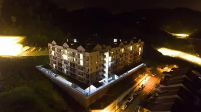 an aerial view of a building at night at Sekata Apartment in Cameron Highlands