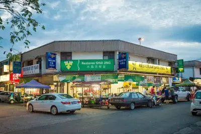 a group of cars parked in front of a building at Park Avenue Hotel Sungai Petani in Sungai Petani