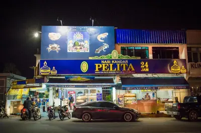 a car parked in front of a restaurant at night at Park Avenue Hotel Sungai Petani in Sungai Petani