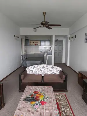a living room with a bed and a couch at FH Comfy Home in Bukit Fraser