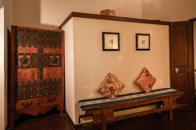 a room with a bench next to a wall at Hotel Penaga in George Town