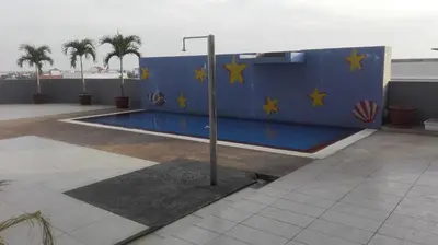 a blue wall with yellow stars and a pole at Sekinchan SeaBreeze Homestay \u9002\u8015\u5e84\u6d77\u98ce\u5439\u6c11\u5bbf in Sekincan