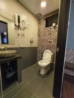 a bathroom with a toilet and a sink at Cute Hotel & Dorms Ipoh in Ipoh