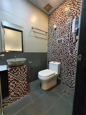 a bathroom with a toilet and a sink at Cute Hotel & Dorms Ipoh in Ipoh