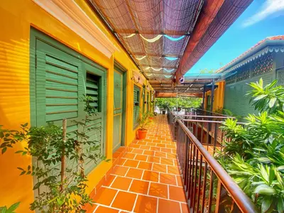 a balcony of a building with plants on it at Yeng Keng Hotel in George Town