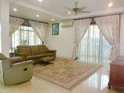 a living room with a couch and a chair at Shuang Yang Sekinchan Homestay 6 in Sekincan