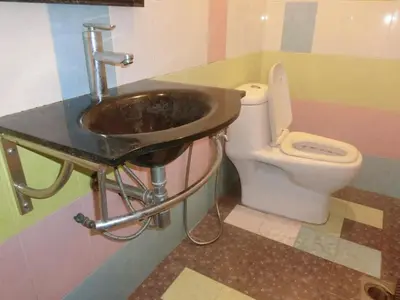 a bathroom with a sink and a toilet at Shuang Yang Sekinchan Homestay 6 in Sekincan