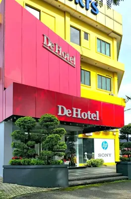 a hotel with a red and yellow building at De Hotel Ipoh in Ipoh