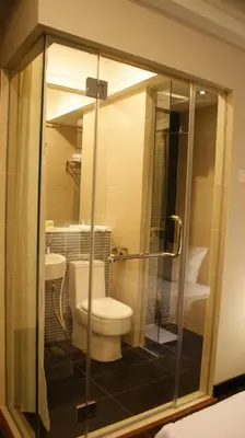a bathroom with a toilet and a sink at De Hotel Ipoh in Ipoh