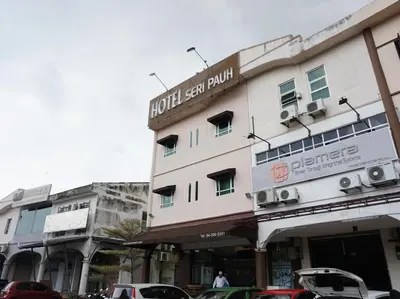 a building with cars parked in front of it at Hotel Seri Pauh in Perai