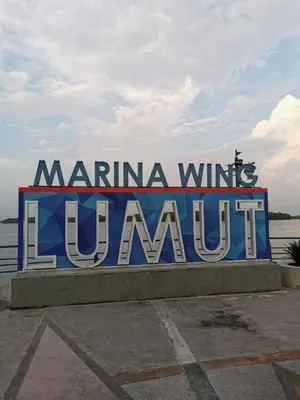 a sign that says marina wine lanuillian at Lumut Titi Panjang Apartment in Lumut