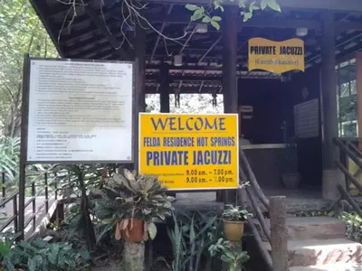a couple of signs in front of a building at Alisa Homestay in Sungkai