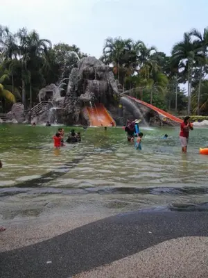 a group of people in the water at a water park at Alisa Homestay in Sungkai