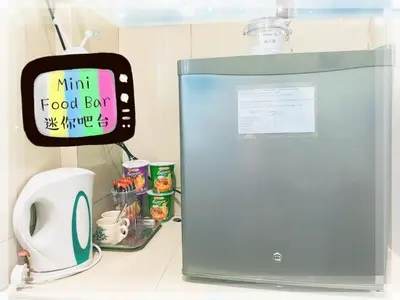 a kitchen counter with a food box and a microwave at Buntong Homestay -Rooms Only in Ipoh